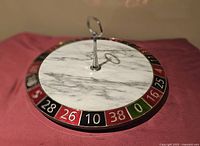 Top view showing full marble cheese board with roulette numbers