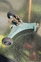 Top view showing entire Swan sprinkler, wheels, brass head, hose connector