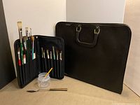 Portfolio case and open brush case with contents