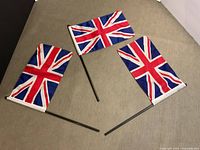 Three Union Jack flags displayed on surface