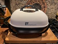 Front view of Market Square electric frying pan assembled with lid