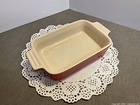 Top view showing cream interior and red sides of dish