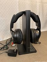 Headphones mounted on transmitter stand