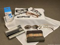 Group view showing all eyeglasses, cases and wipe box