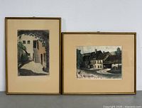 Both framed etchings side by side