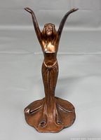 Front view of statue showing full figure and base