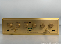 Front view showing controls and gold faceplate