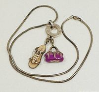 Full view of necklace with both charms attached