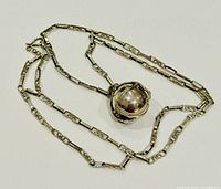 Closed ball locket on patterned sterling chain