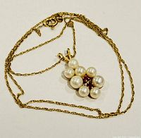 Full view of necklace laid flat showing chain style and pendant