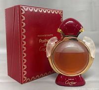 Bottle in front of outer cardboard sleeve