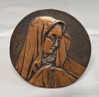 Full view of plaque front showing design and shape