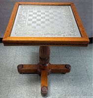 Full view of oak pedestal chess table showing top, column, and base