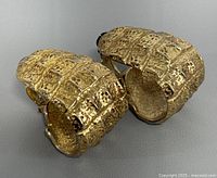 Both earrings front angle showing crocodile texture and gold finish