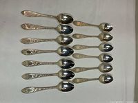 Thirteen Birks sterling teaspoons arranged face up