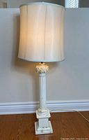 Lamp illuminated with shade attached showing overall appearance