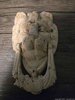 Front view showing lion head and striker ring