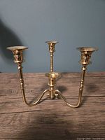 Front view showing three arms and candle sockets