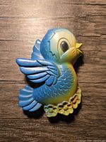 front view of bluebird chalkware plaque
