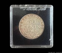 Reverse of 1918 Newfoundland 50 Cents coin in holder
