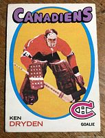 Front of 1971-72 OPC Ken Dryden rookie card showing player, team name and logo