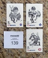 Close-up of three notable cards: Wayne Gretzky #99, Wendel Clark #17, Patrick Roy #33