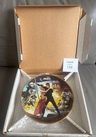 Plate in original open box with COA visible