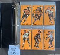 Binder open showing six 1994-95 Parkhurst Tall Boys Boston Bruins cards in nine-pocket sheet