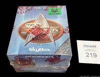 Top view of sealed wax box showing logo, shrinkwrap and price sticker