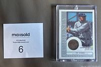 Front of sealed Ty Cobb Currency Collection coin card showing image, embedded penny, MaxSold lot card