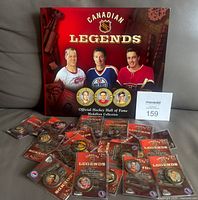 Front view of album and spread of sealed medallions