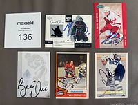 Six featured signed cards including Datsyuk, Cournoyer, Gilmour, Hull and Patrick Roy Great Gloves insert