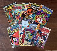 All nine comics fanned out showing covers