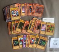 Spread of 83 dragon-theme Yu-Gi-Oh cards front side