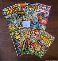 Eight Marvel horror comics fanned on floor