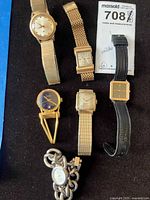 Group shot of all six wristwatches