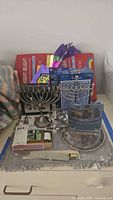 overall lot showing two menorahs, candlestick, plate, games