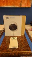 Front view of sealed Nest Cam Outdoor retail box