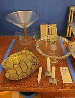Full lot showing martini bowl, turtle shell bowl, pedestal dish, turtle candle holders with candles