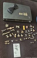 Overall view of all accessories laid out including box and bow tie