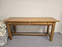 Front view of wooden console table with two drawers