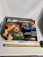 Front of original box showing artwork and bilingual text