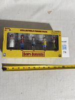 Front view of sealed Bob's Burgers Series #1 figure pack showing all five figures in window box.