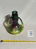 Front view of vase showing overall design and color gradient, tape for scale