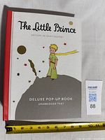 Front cover showing title, author, edition, ruler for scale