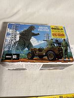 Front of MPC Godzilla Movie Army Willys Jeep model kit box