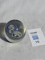 Front angle of signed Eickholt jellyfish paperweight with Maxsold tag visible