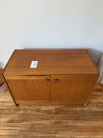 Front view of teak record cabinet