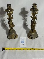 Both candlesticks front view with scale