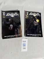 Both Punisher MAX trade paperbacks front covers visible